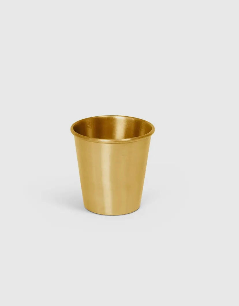 Close-up of brass tumbler.