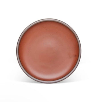 An Amaro dinner plate with a brown rim form East Fork