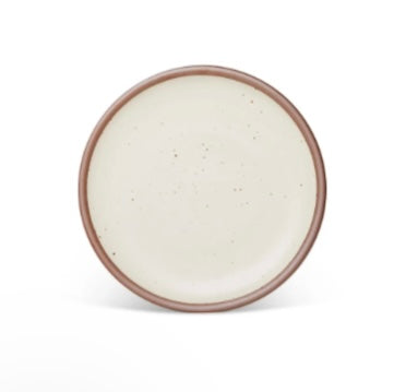 An Panna Cotta dinner plate with a brown rim form East Fork