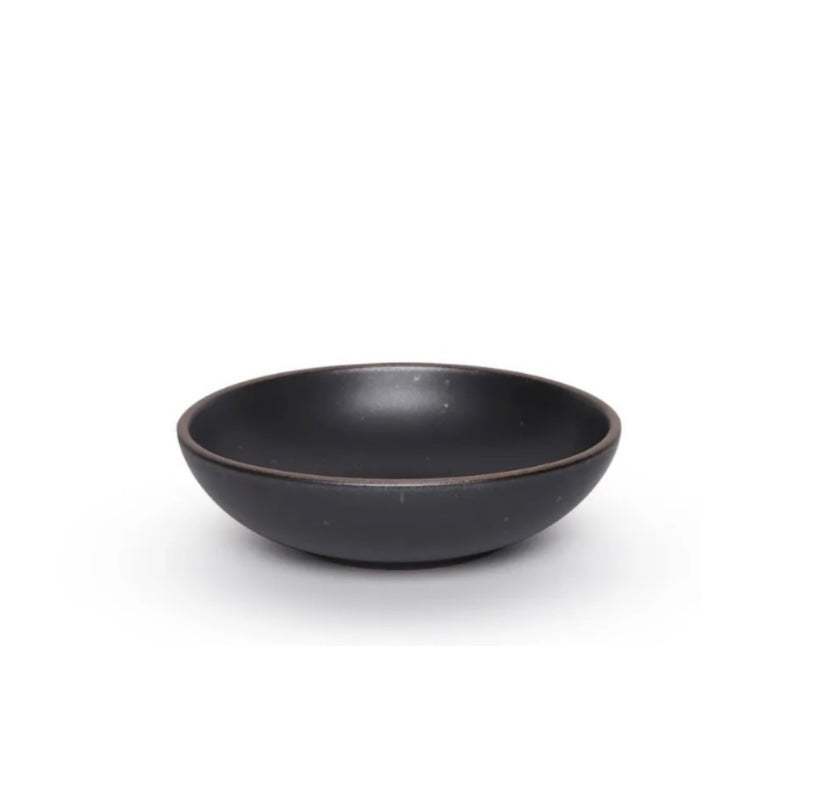 An Black Mountain ceramic serving bowl with a brown rim and speckled texture.