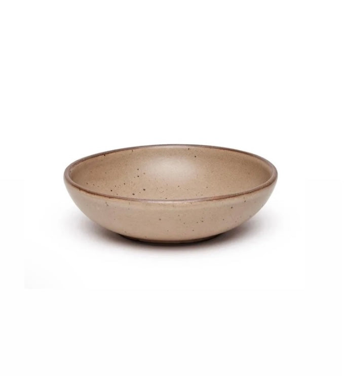 A Morel ceramic serving bowl with a brown rim and speckled texture.