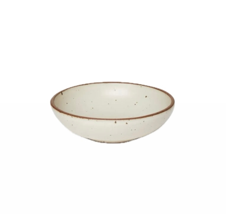 An Panna Cotta ceramic serving bowl with a brown rim and speckled texture.