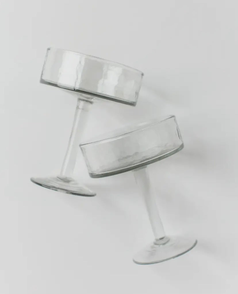 Close-up of recycled glass coupe showing hammered finish and handmade texture.