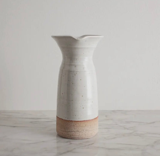 Close-up of artisan carafe showing subtle glaze and unique form.