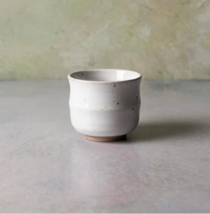Stoneware tea cup, 3 inches tall, showing hand-glazed finish