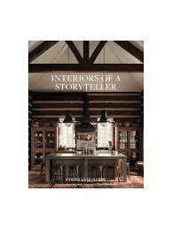 Book cover of 'Interiors of a Storyteller' with a interior design setting.