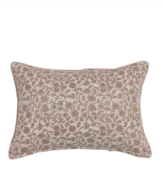 A beige floral print pillow cover with a zipper closure.