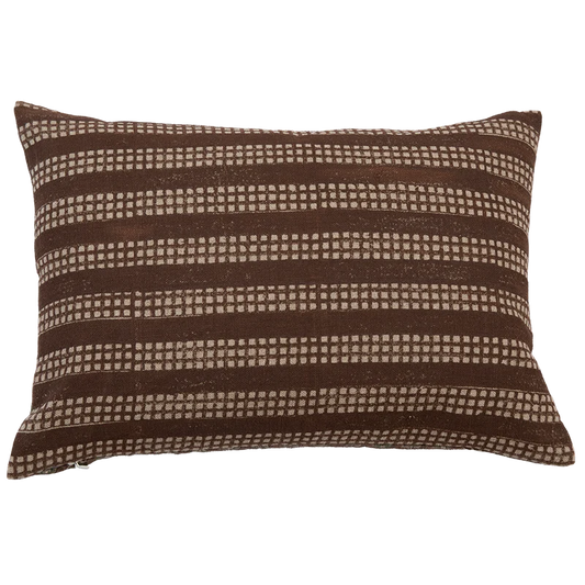 A square-shaped throw pillow with a brown and white geometric pattern by Filling Spaces
