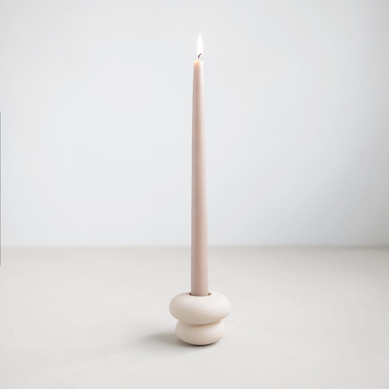 Small white ceramic taper holder.