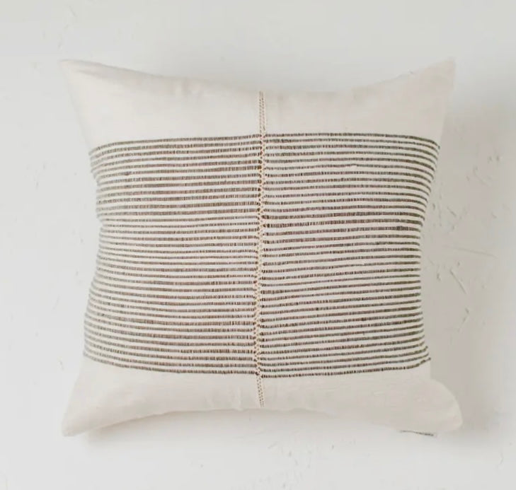 A handstitched pillow cover with a textured ribbed motif and traditional Ethiopian hand stitch on both sides.