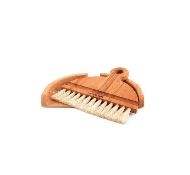 Table brush pictured at angle. By Iris Hantverk.