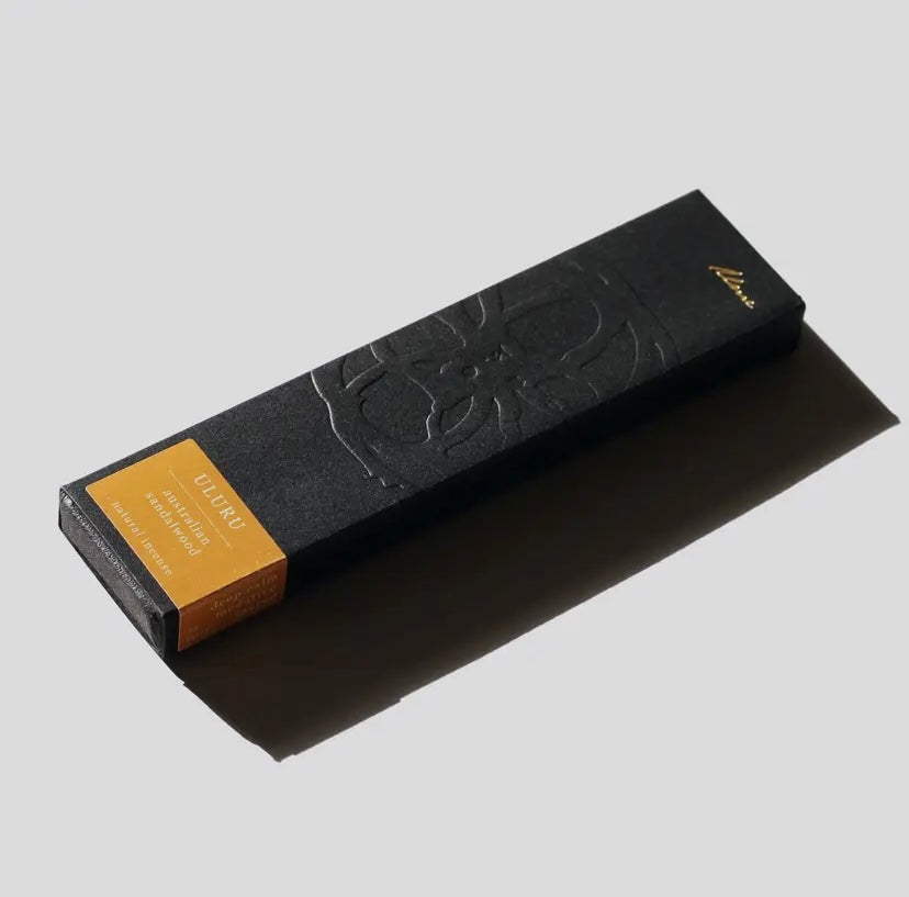A black box of ULURU incense sticks with a design embossed on the front, named after Earth’s solar plexus chakra.