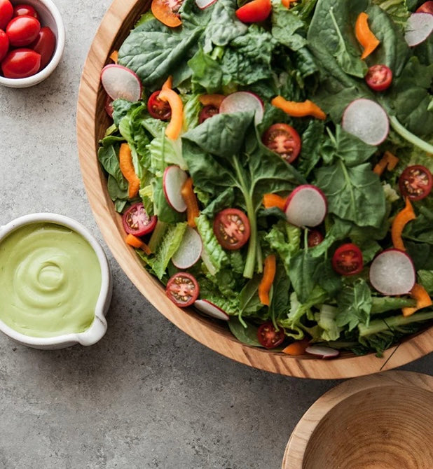 Ash wood bowl displayed with salad.