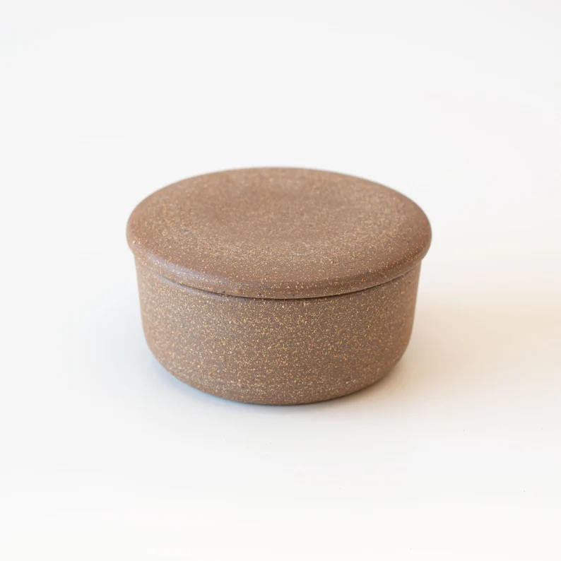 Close-up of USA-made ceramic butter container with rough glaze finish