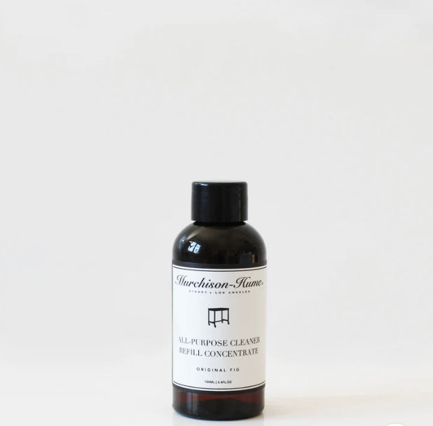 A bottle labeled 'Murchison Hume's All Purpose Cleaner' with a smaller black cap next to it, indicating a refill concentrate for a spray bottle.