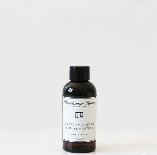 A bottle labeled 'Murchison Hume's All Purpose Cleaner' with a smaller black cap next to it, indicating a refill concentrate for a spray bottle.