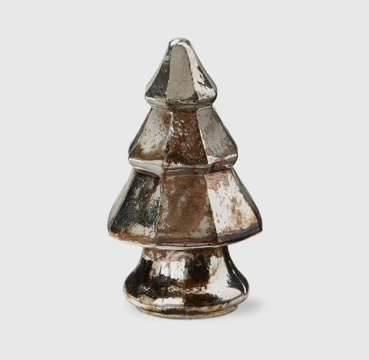 Decorative silver Christmas tree ornament on a light gray background