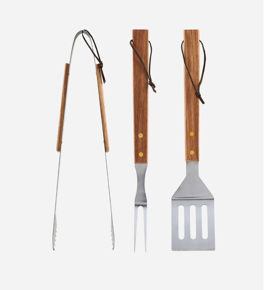 A set of grilling tools consisting of a barbeque tong, palette knife, and barbeque fork. The tools have wooden handles and stainless steel accents.