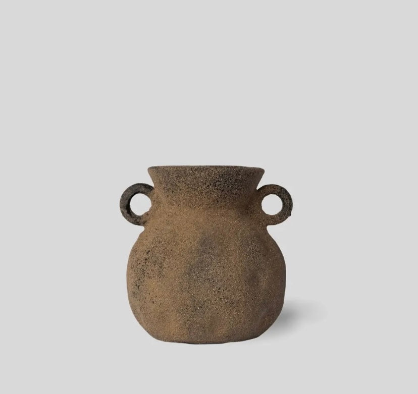Handmade rustic clay vase with textured imprints