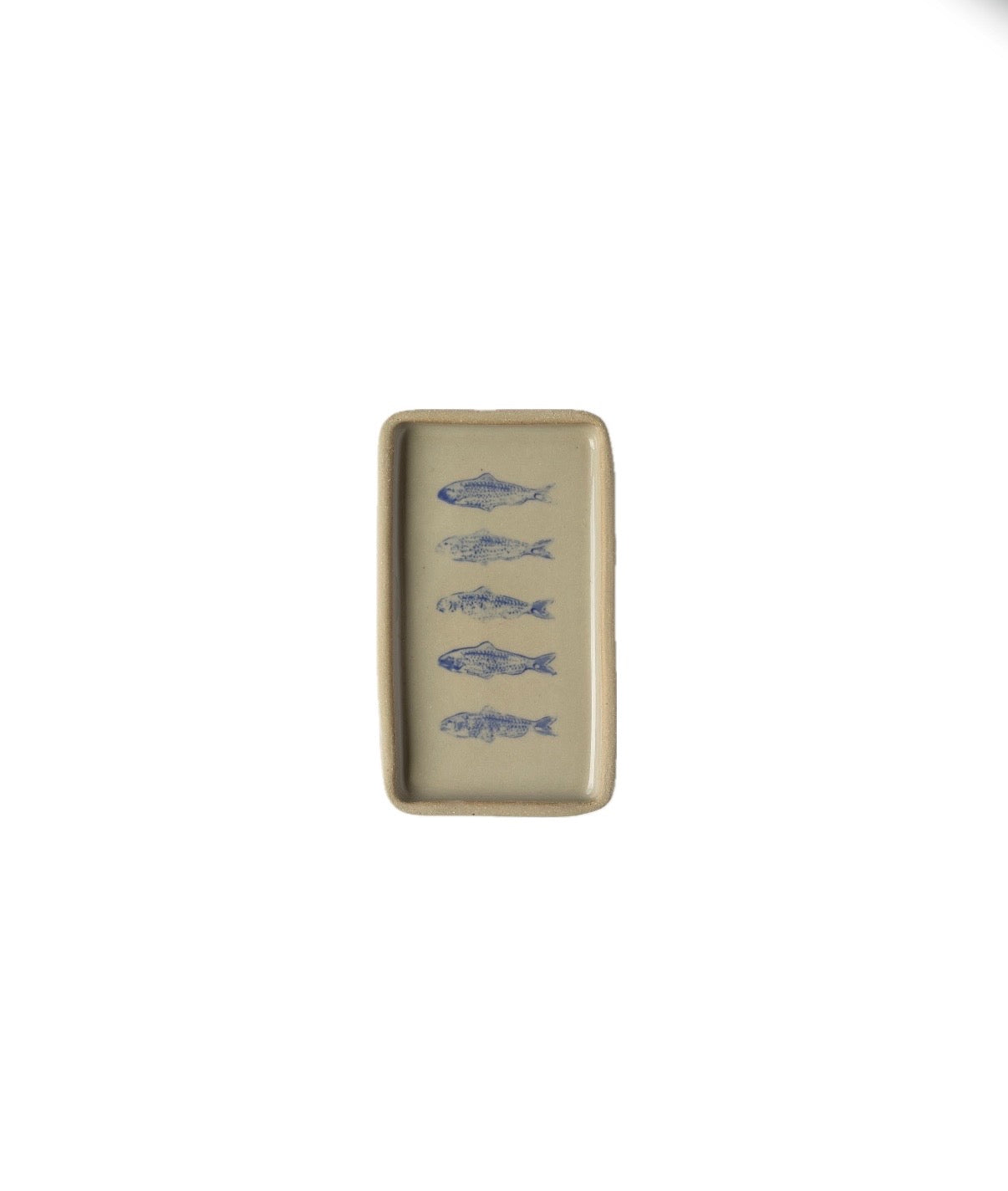 Rectangular ceramic plate with blue fish designs on a beige background