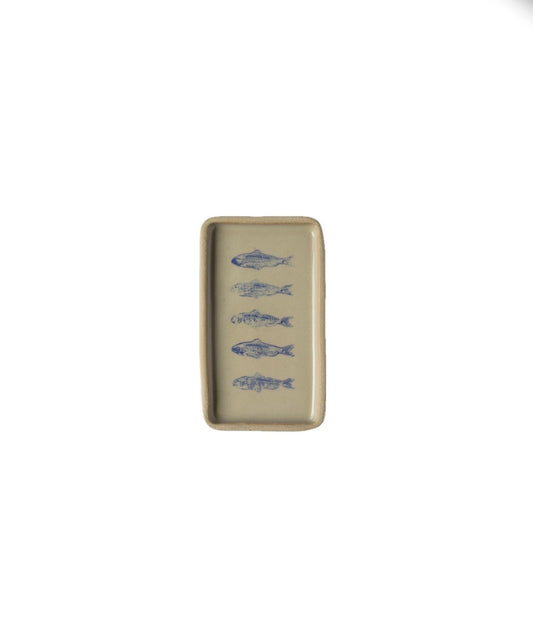 Rectangular ceramic plate with blue fish designs on a beige background