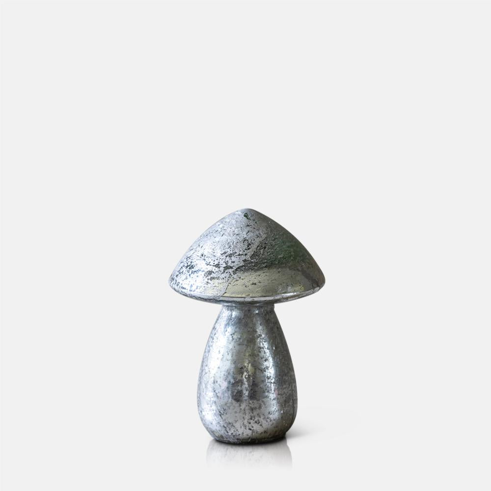 Mushroom-shaped silver decorative with a textured surface on a white background