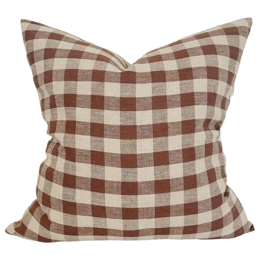 Checkered pillow with brown and beige pattern on a white background