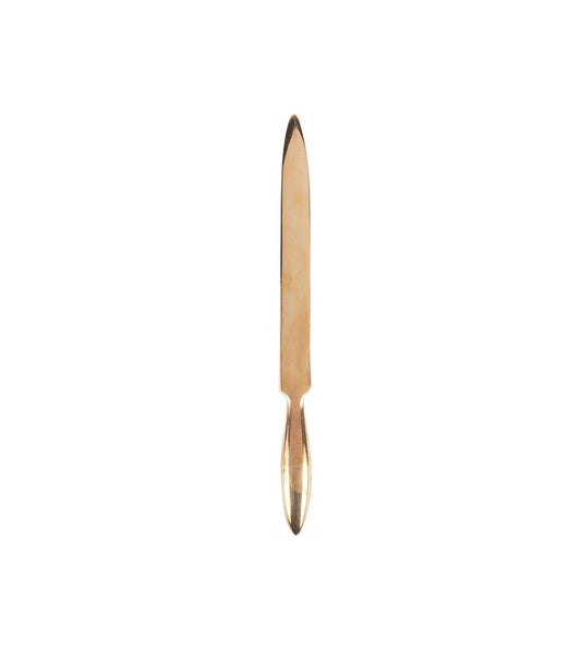 Gold brass letter opener on a white background