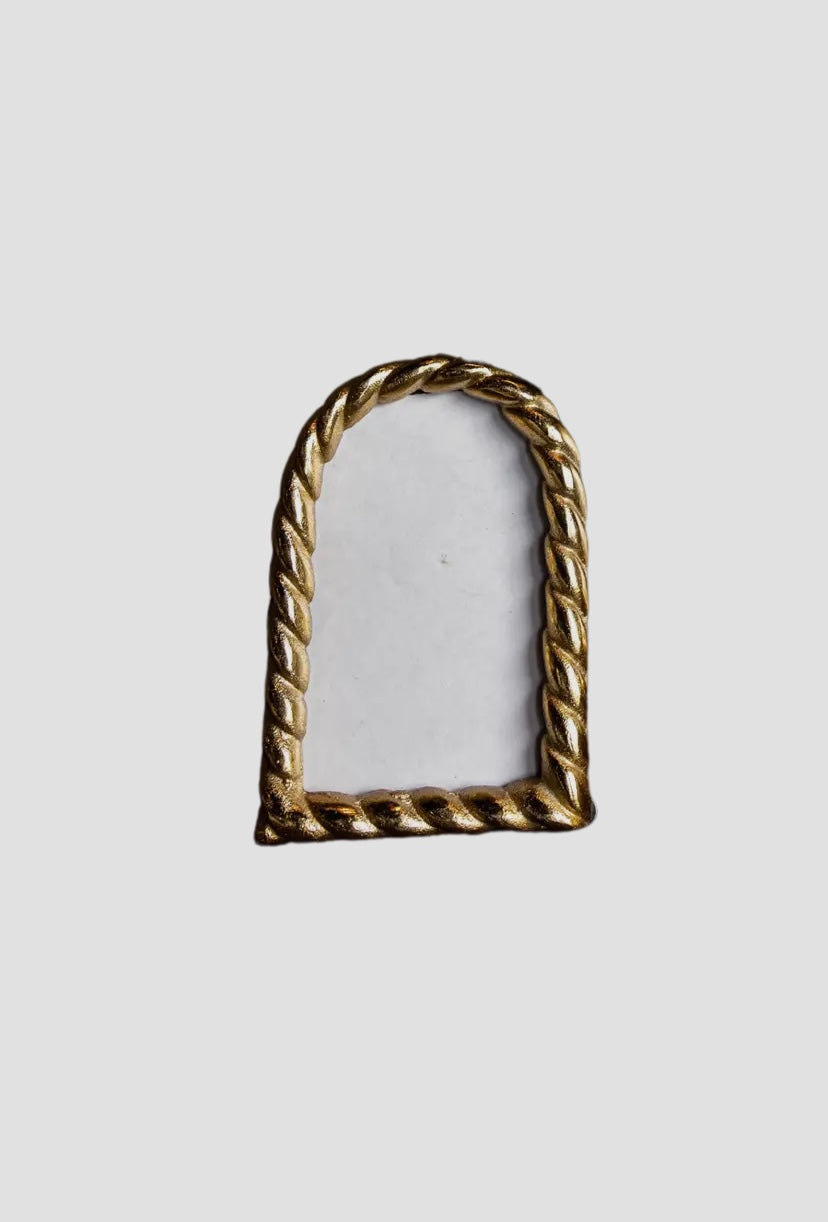 Brushed gold arch frame.