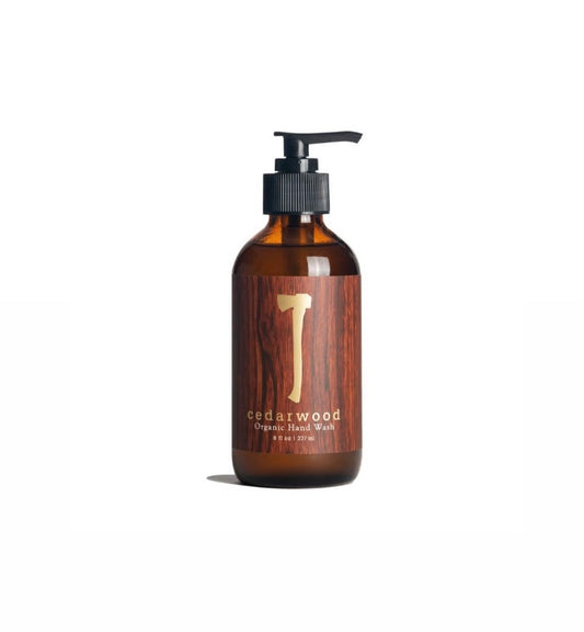 A brown glass bottle of CedarWood Organic Liquid Hand Soap with a pump dispenser, labeled with the brand and product name.