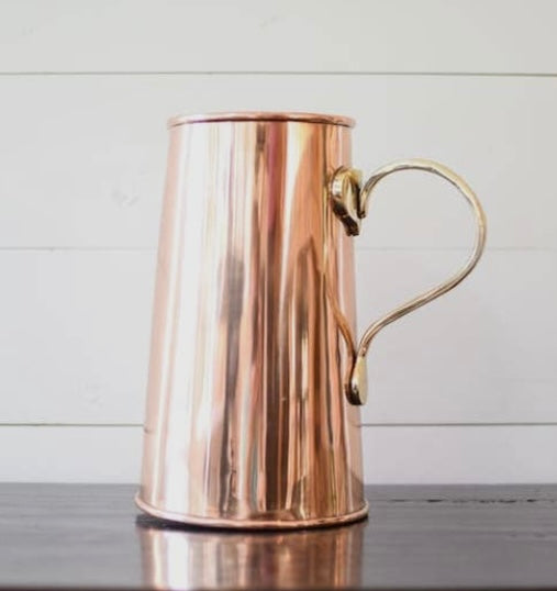 COPPER PITCHER on counter.