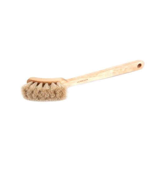 Bristle brush with wooden handle on a white background by iris hantverk