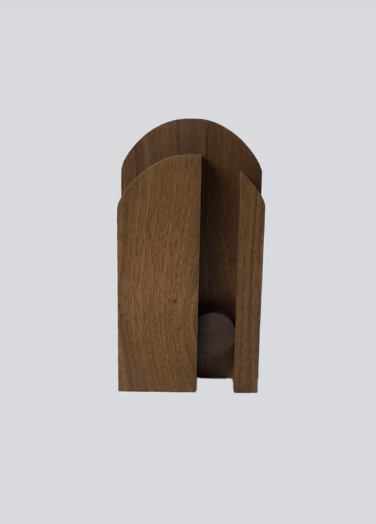 Wooden broom hanger on a light gray background