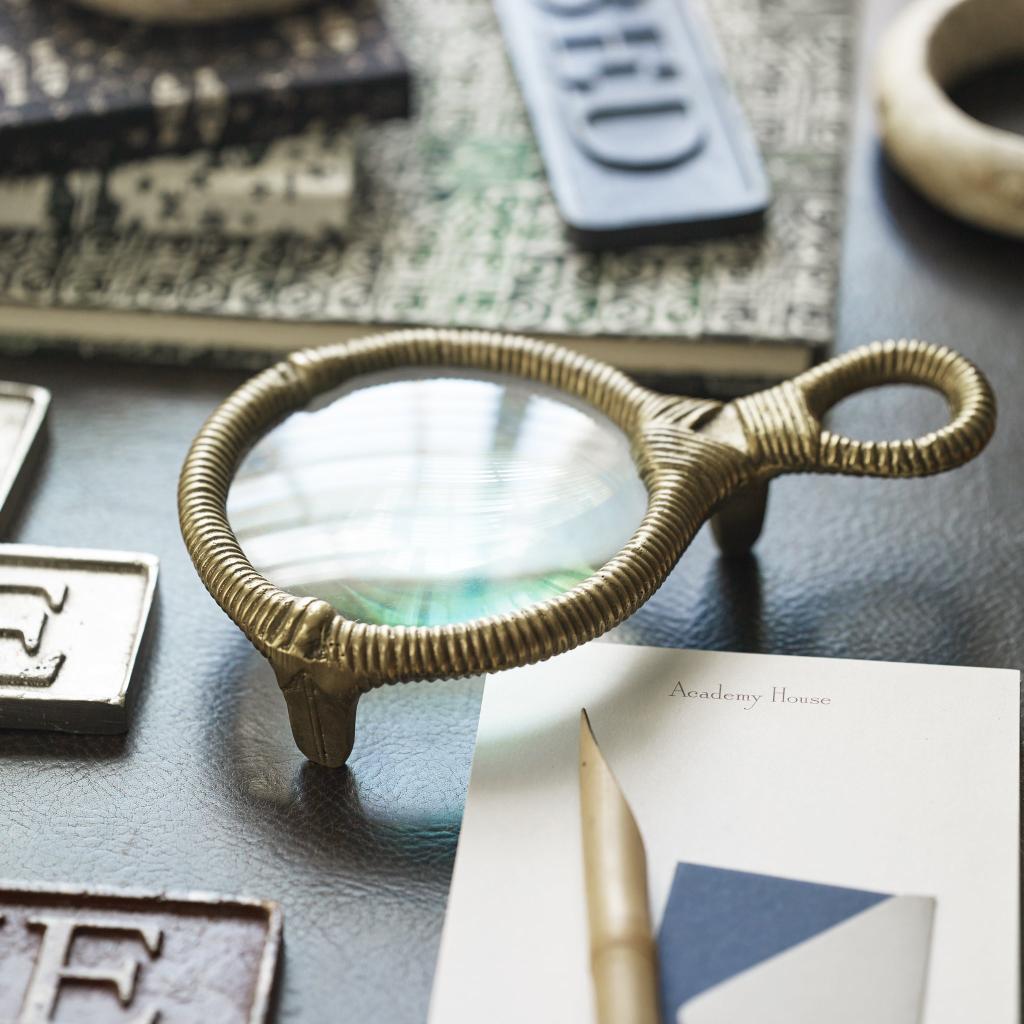 Brass magnifying glass on a desk
