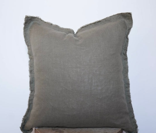 A moss green linen pillow cover with fringed edges on a white background.