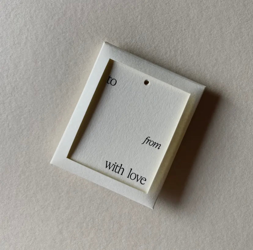 Square jewelry display card with 'to', 'from', and 'with love' text on a beige background