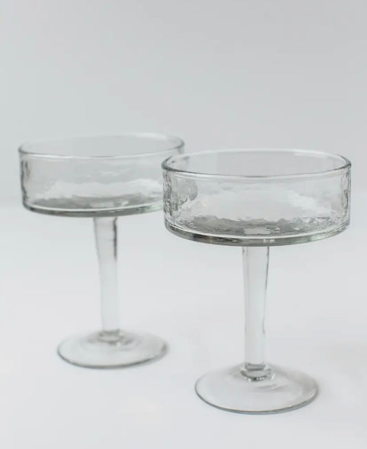Close-up of recycled glass coupe showing hammered finish and handmade texture.