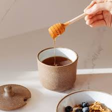 Close-up of Sawyer Ceramics honey jar showing glossy glaze and rounded knob