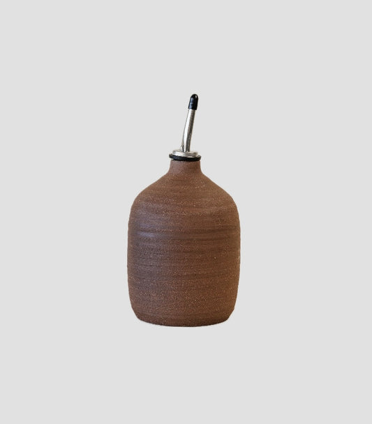Artisan oil dispenser made in the Southwest with earthy, unglazed finish.