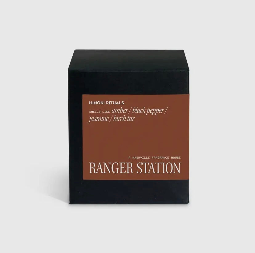 Candle packaging with 'Hinoki Rituals' and 'Ranger Station' text on a white background