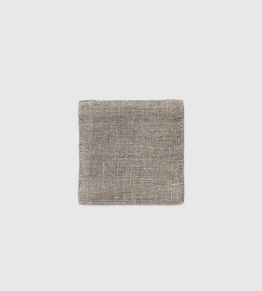 A single linen coaster with a natural grey color, displayed on a white background.