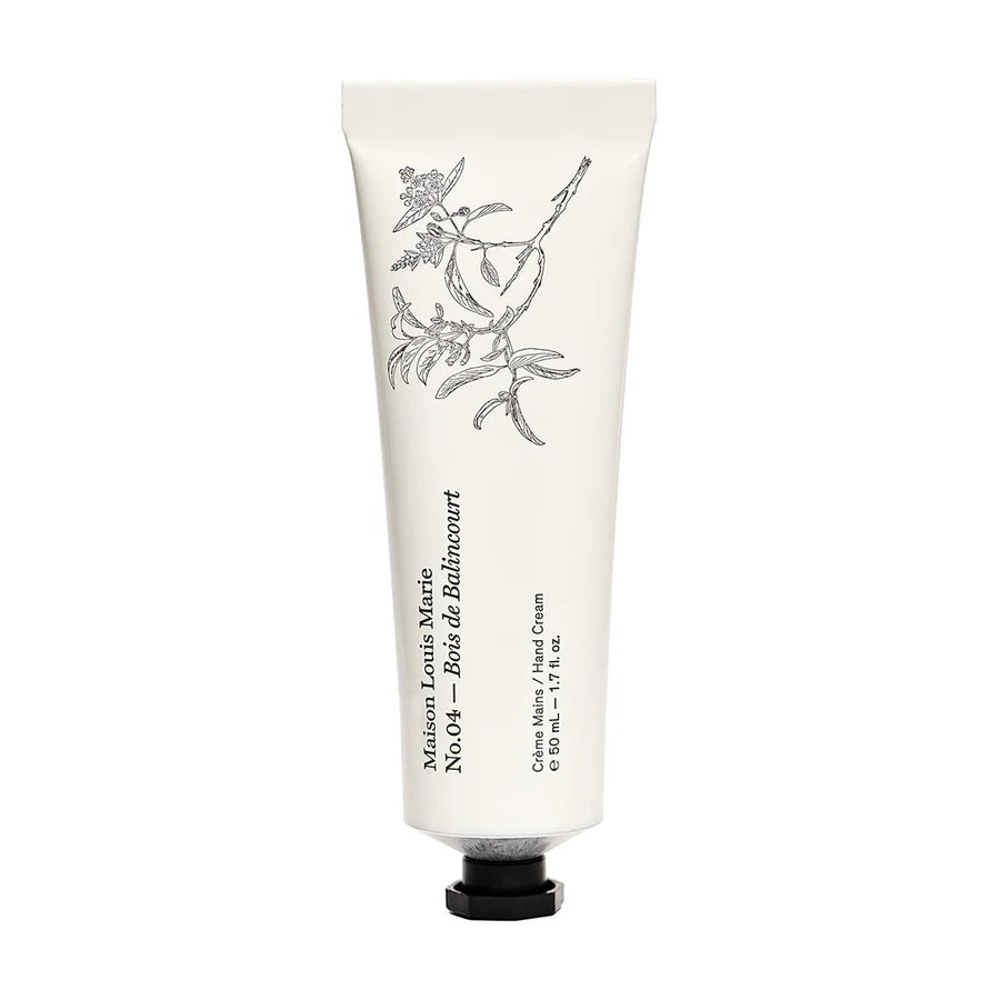 Hand cream tube with floral design and brand name on a white background