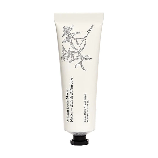 Hand cream tube with floral design and brand name on a white background