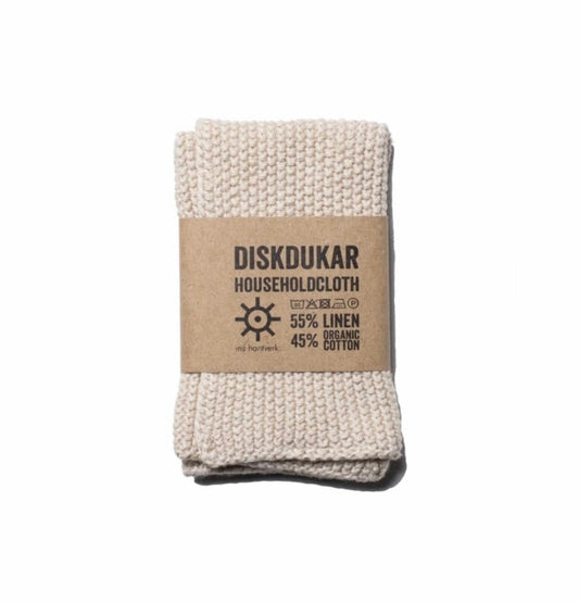 A beige cleaning cloth with a textured weave, labeled 'IRIS HANTVERK' and 'HOUSEHOLD CLOTH', displaying the composition '55% LINEN 45% ORGANIC COTTON'.