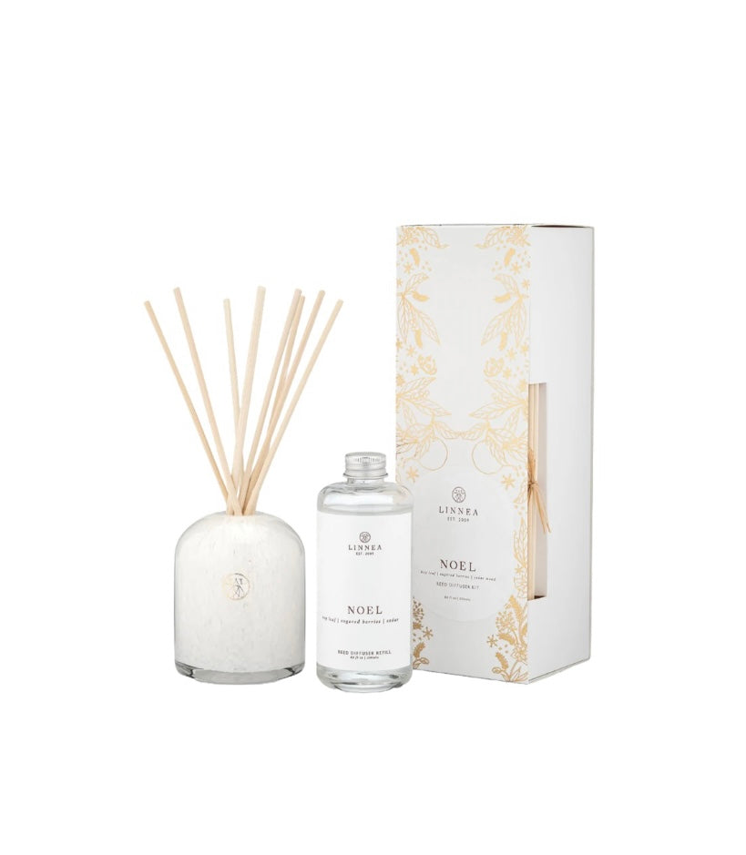 Diffuser set with bottle, sticks, and packaging on a white background Noel Christmas scent.