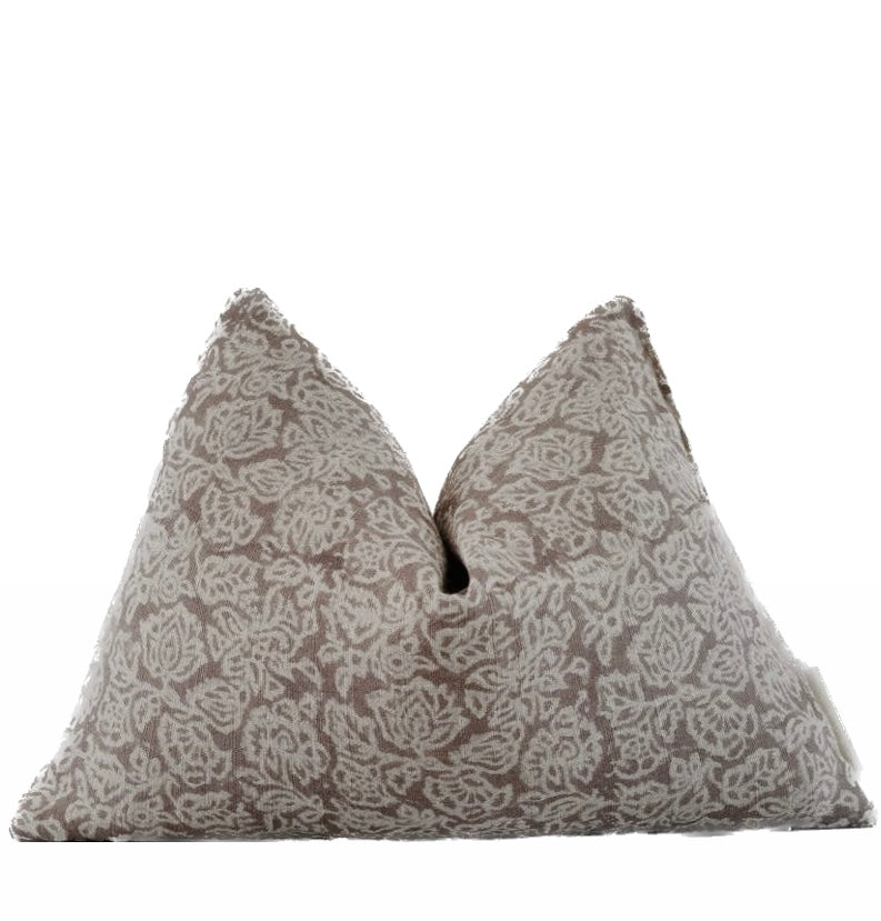 A beige floral patterned lumbar pillow cover with a zipper closure, displayed against a white background.
