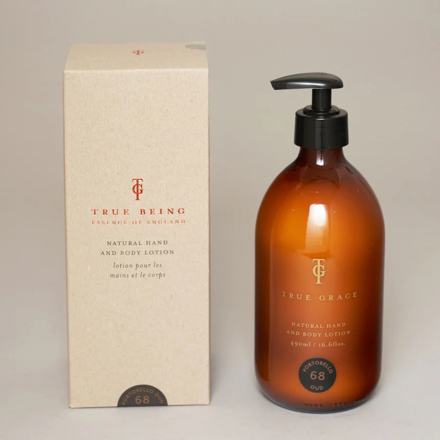 A pump bottle of True Grace hand lotion next to its cardboard packaging box, labeled as 'natural hand care' with 660 ml volume indicated.