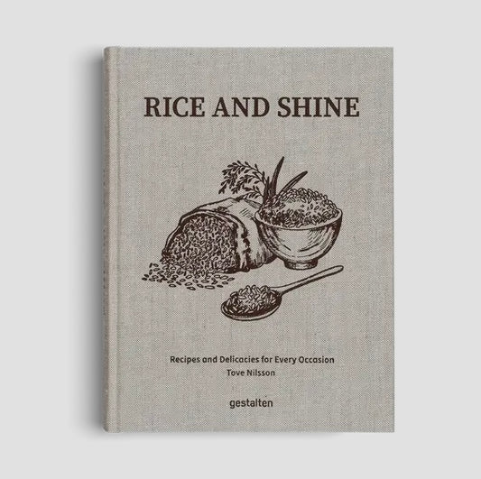 Book titled 'Rice and Shine' with illustrations of rice, bread, and a bowl on a gray background