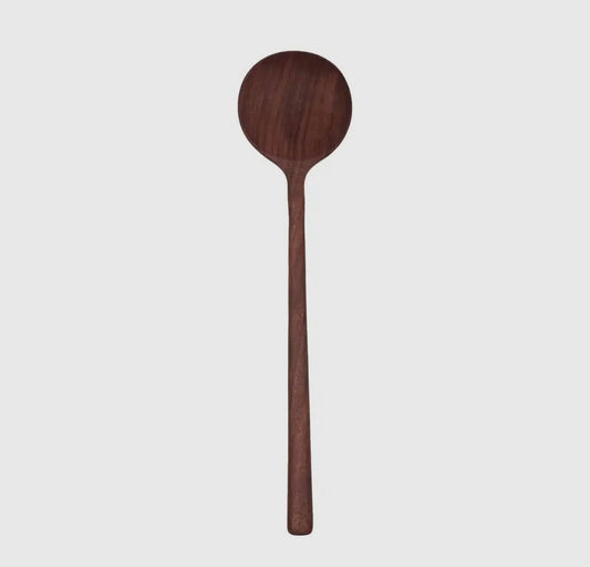A handmade walnut wooden spoon with a round bowl and a long handle.