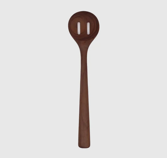 A handmade walnut wooden slotted spoon with a smooth finish.